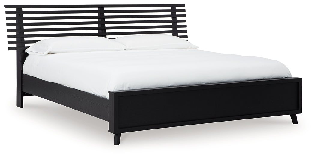 Danziar King Panel Bed with Mirrored Dresser and Nightstand